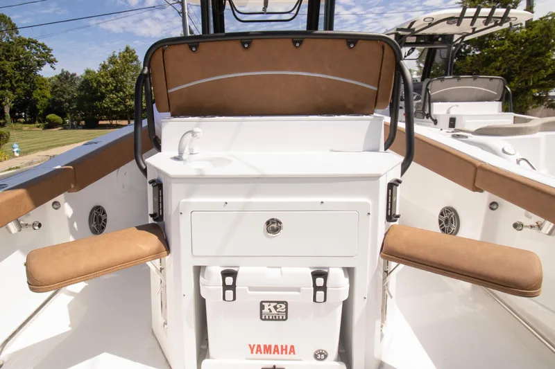 Slide: The Image of 2026 Sea Hunt Ultra 265 SE boat interior with seating and storage. - 7