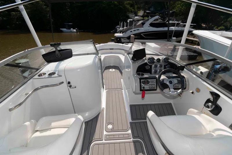 Slide: The Image of 2006 Formula 240 Bowrider boat interior with steering wheel and dashboard controls. - 22