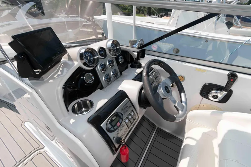 Slide: The Image of Helm of 2006 Formula 240 Bowrider with steering wheel, gauges, and navigation equipment. - 24