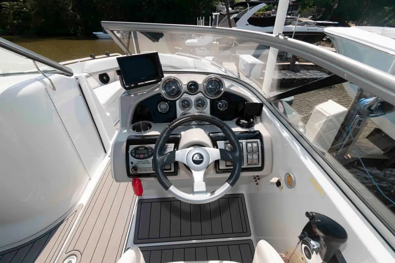 Slide: The Image of 2006 Formula 240 Bowrider dashboard with steering wheel and controls. - 25