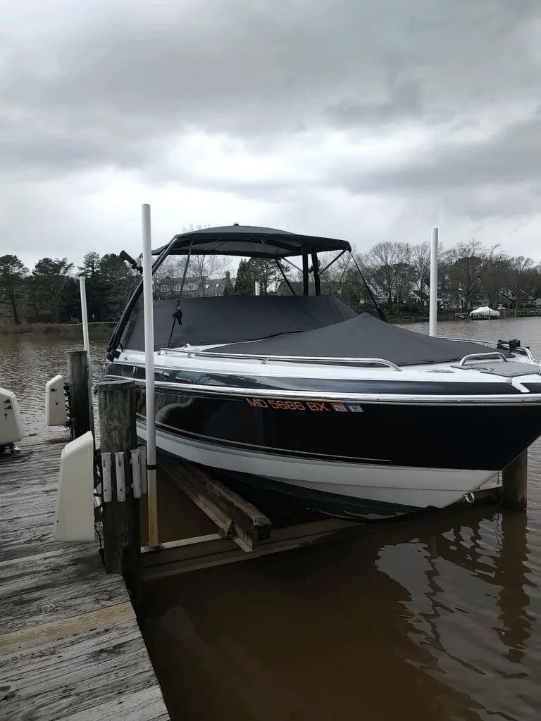 Slide: The Image of 2006 Formula 240 Bowrider boat docked on a cloudy day. - 6