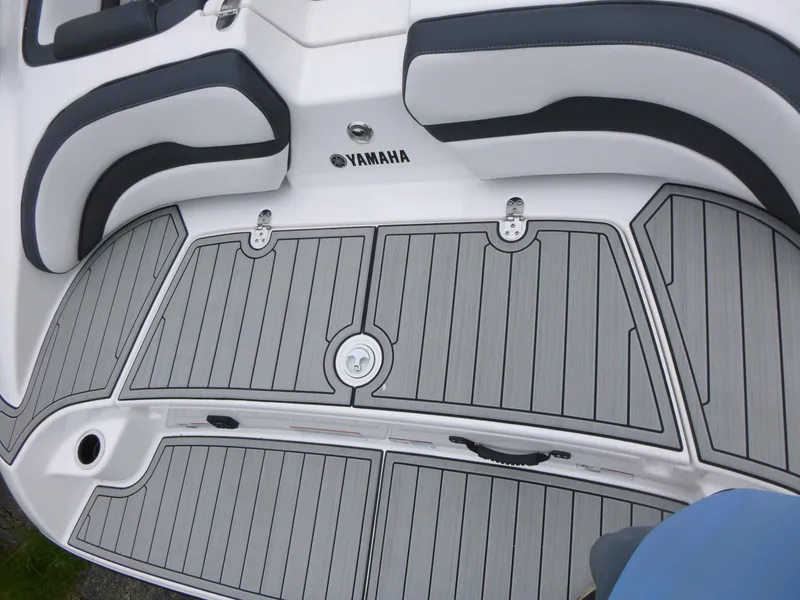 Slide: The Image of 2025 Yamaha Boats 195S deck with sleek seating and modern design. - 14