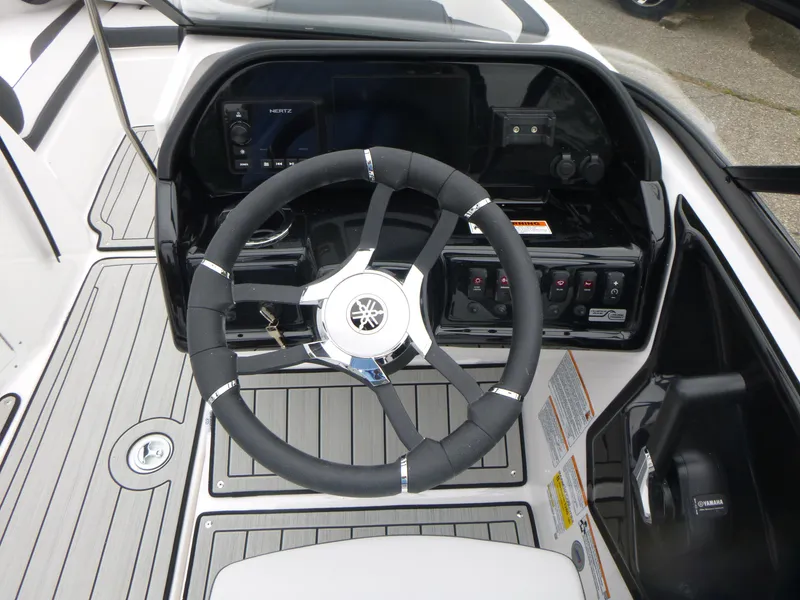 Slide: The Image of 2025 Yamaha Boats 195S steering wheel and dashboard, featuring modern controls and sleek design. - 7
