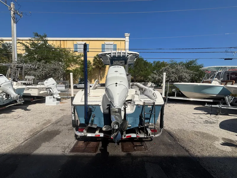 Slide: The Image of 2022 Sea Pro 239 Center Console boat on trailer, rear view, in outdoor lot. - 4