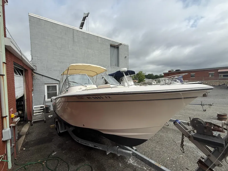 The Image of 2007 Grady-White Tournament 275 boat on trailer near industrial building. - 0