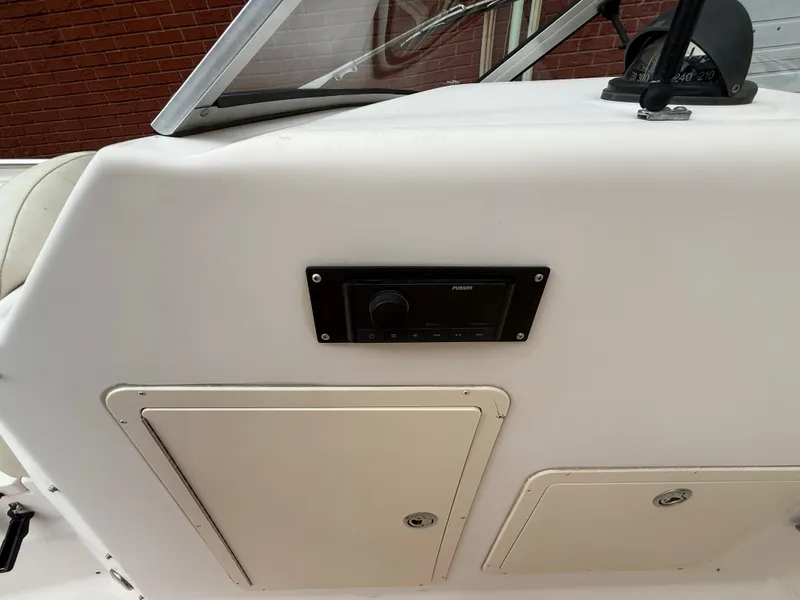 Slide: The Image of 2007 Grady-White Tournament 275 boat dashboard with Fusion stereo system. - 13