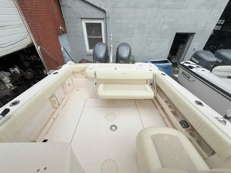 Slide: The Image of 2007 Grady-White Tournament 275 boat interior with seating and dual Yamaha engines. - 4