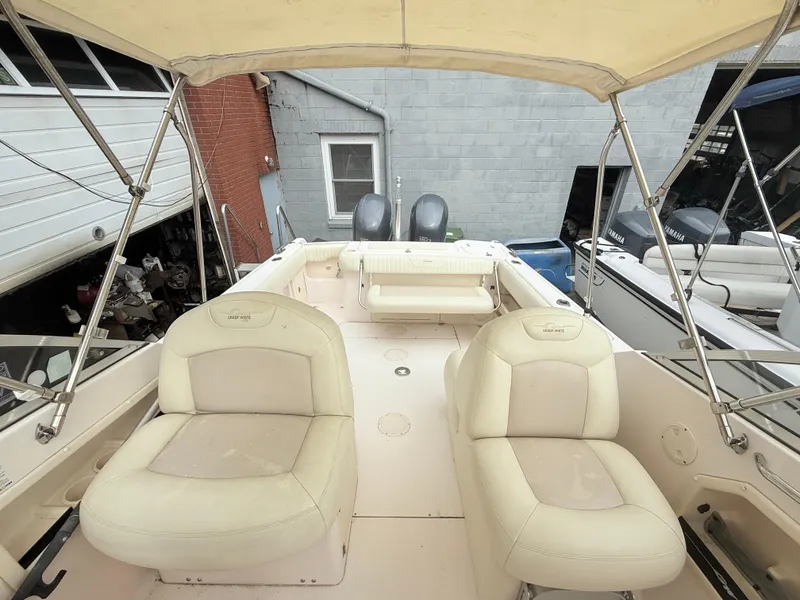 Slide: The Image of 2007 Grady-White Tournament 275 boat interior with seating and canopy in a storage area. - 6