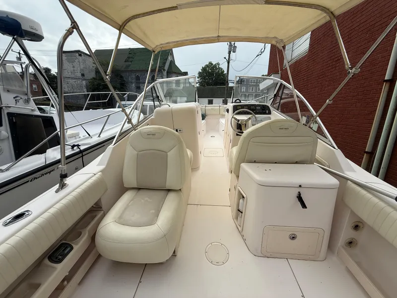 Slide: The Image of 2007 Grady-White Tournament 275 boat interior with seating and helm under canopy. - 7