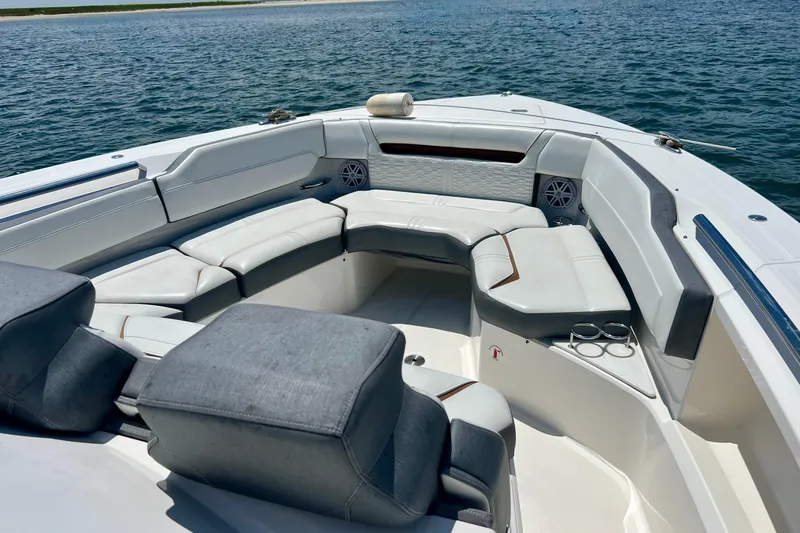 Slide: The Image of Luxurious seating area on 2020 Tiara Yachts 43 LS, overlooking serene waters. - 10