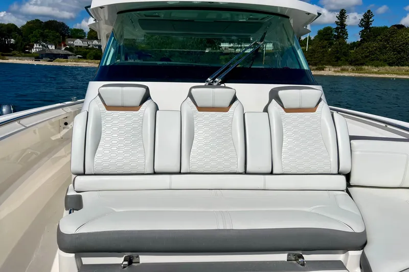 Slide: The Image of 2020 Tiara Yachts 43 LS boat with luxurious seating on a sunny day. - 12