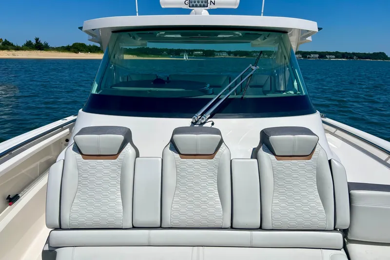 Slide: The Image of 2020 Tiara Yachts 43 LS boat with luxurious seating on open water. - 13