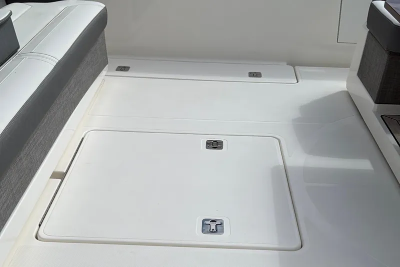 Slide: The Image of 2020 Tiara Yachts 43 LS deck with storage compartments and seating area. - 21