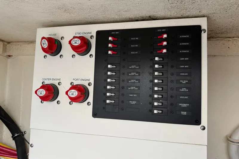Slide: The Image of Electrical panel of a 2020 Tiara Yachts 43 LS, featuring engine and battery controls. - 24