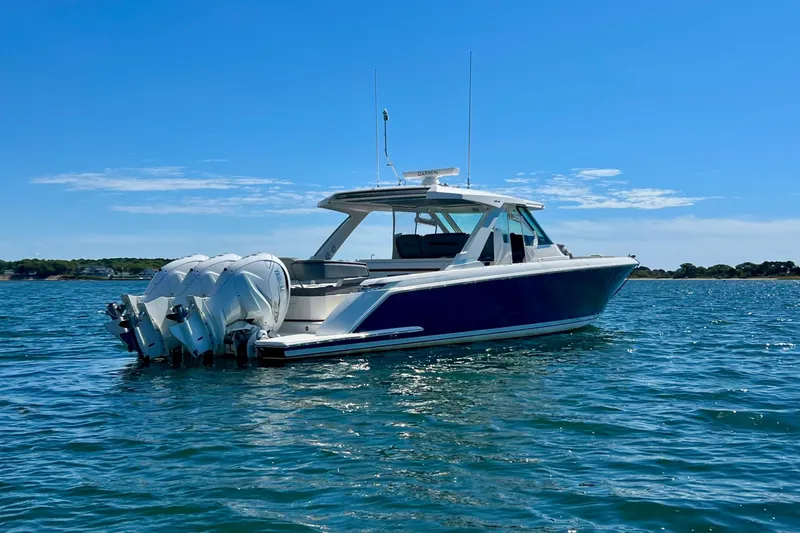 Slide: The Image of 2020 Tiara Yachts 43 LS in open water, featuring sleek design and powerful engines. - 4