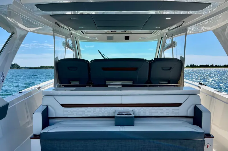 Slide: The Image of 2020 Tiara Yachts 43 LS luxury boat interior with seating, ocean view. - 8