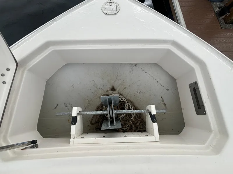 Slide: The Image of 2023 Sailfish 272 CC boat docked, showcasing spacious seating and modern design. - 18