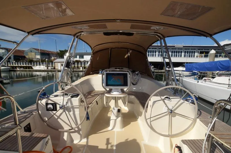 Slide: The Image of Cockpit of 2016 Marlow-Hunter 40 sailboat with dual steering wheels and navigation system. - 10