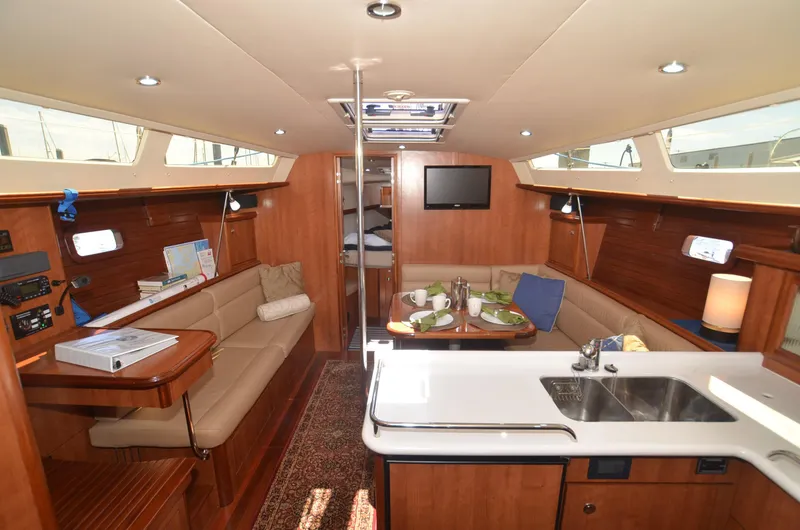 Slide: The Image of Interior of 2016 Marlow-Hunter 40 yacht with modern kitchen and cozy seating area. - 12
