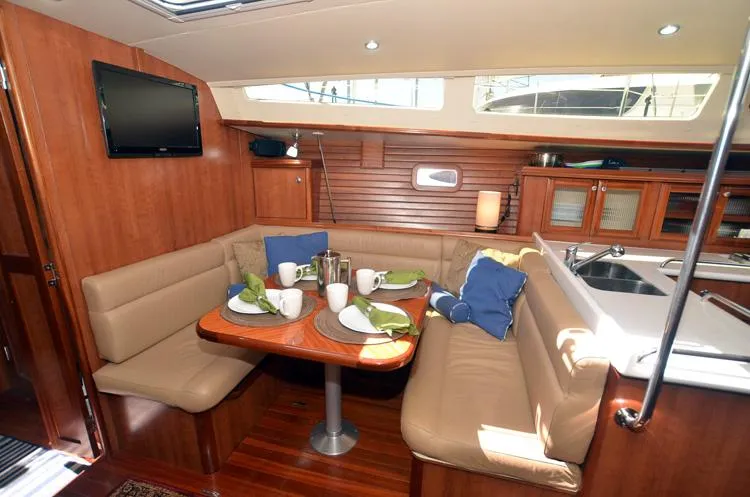 Slide: The Image of Interior of 2016 Marlow-Hunter 40 yacht with cozy dining area and modern amenities. - 13