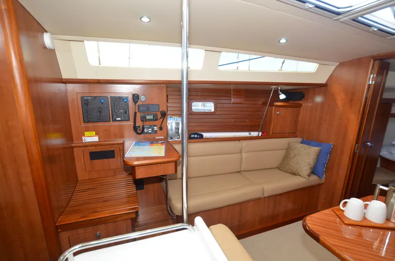 Slide: The Image of Interior of 2016 Marlow-Hunter 40 yacht with wood paneling and beige seating. - 16