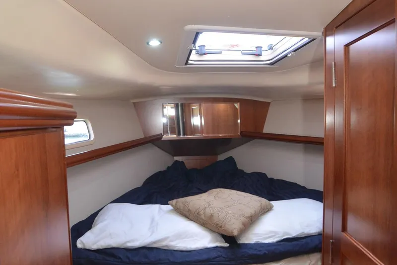 Slide: The Image of Cozy cabin interior of 2016 Marlow-Hunter 40 sailboat with skylight and wooden finishes. - 20