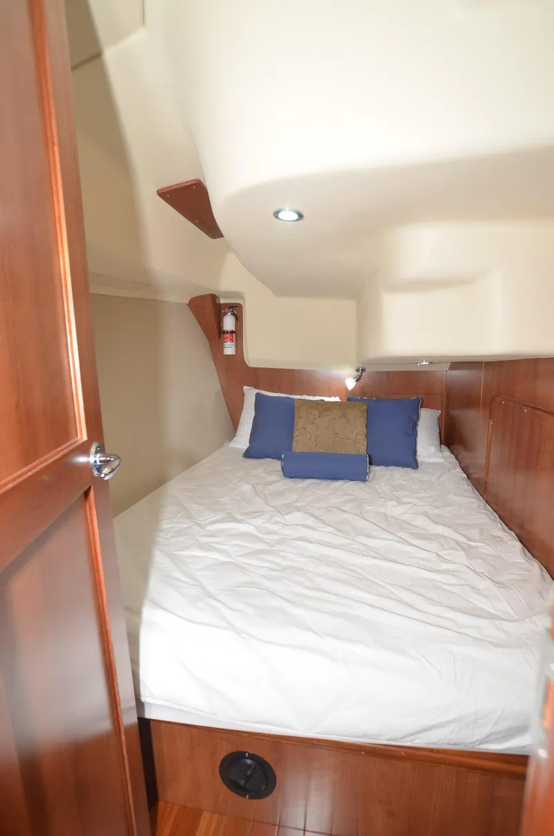 Slide: The Image of Cozy cabin interior of 2016 Marlow-Hunter 40 sailboat with bed and wooden accents. - 24