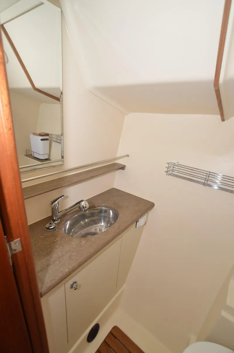 Slide: The Image of 2016 Marlow-Hunter 40 yacht bathroom with sink and mirror. - 26