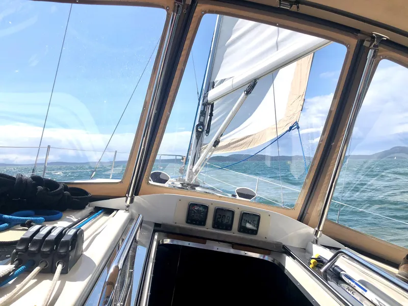 Slide: The Image of Cockpit view from a 2016 Marlow-Hunter 40 sailboat navigating open waters. - 7