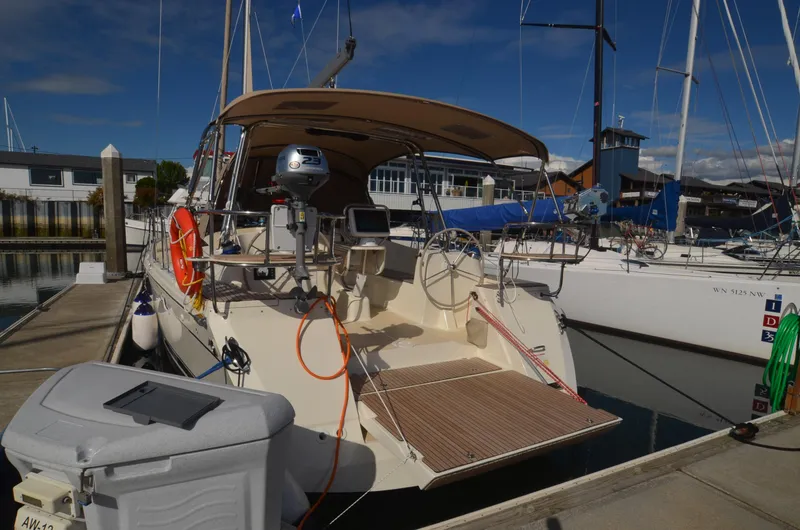 Slide: The Image of 2016 Marlow-Hunter 40 sailboat docked at marina, featuring spacious cockpit and modern equipment. - 8