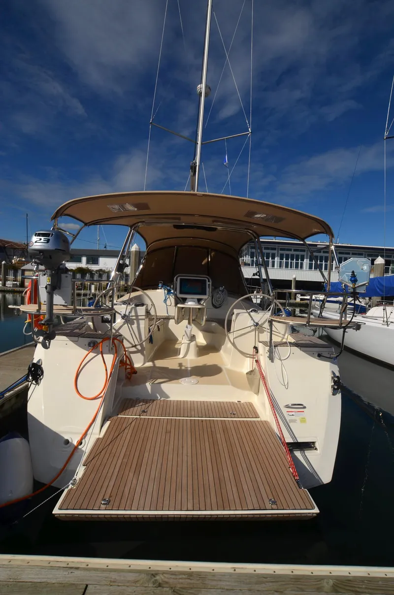 Slide: The Image of 2016 Marlow-Hunter 40 sailboat docked, featuring spacious cockpit and modern design. - 9