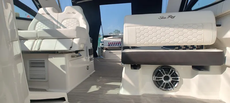 Slide: The Image of 2021 Sea Ray Sundancer 320 interior with white seating and modern design elements. - 20