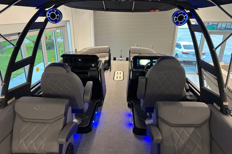 Slide: The Image of Interior of 2025 Veranda VX 27 DCRC boat with luxurious seating and modern controls. - 7