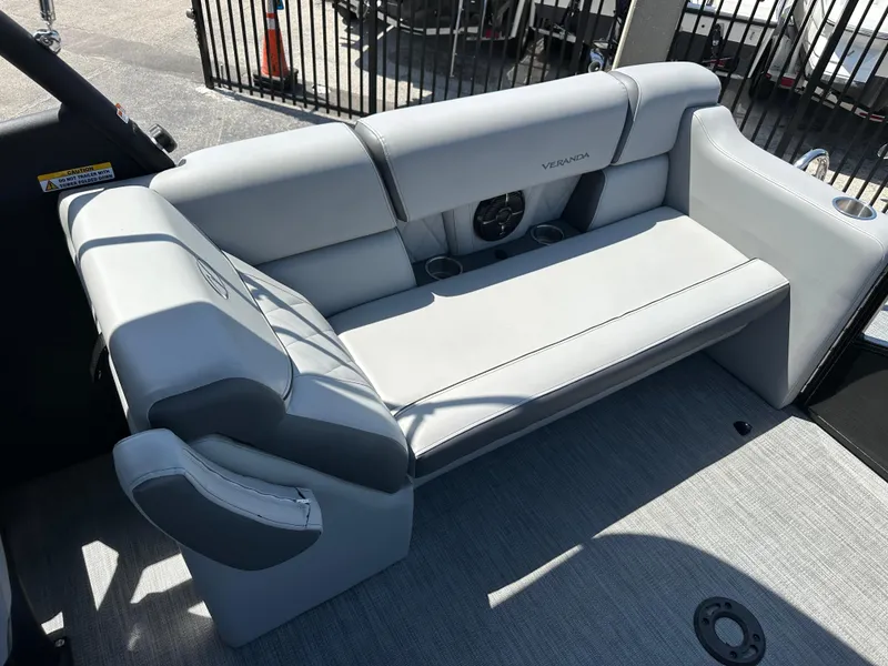 Slide: The Image of 2025 Veranda VX 25 RC boat interior with sleek gray seating and cup holders. - 17