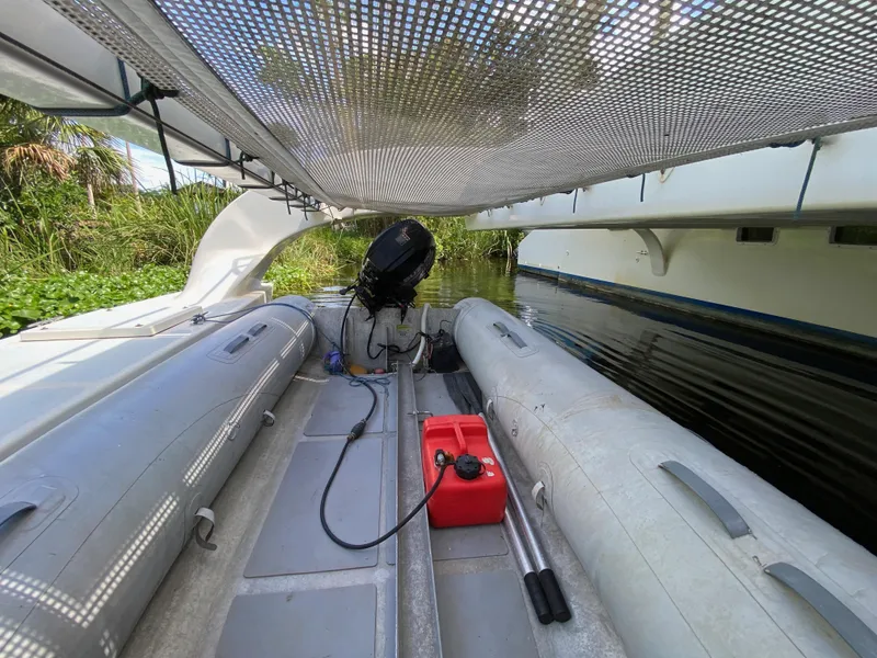 Slide: The Image of Inflatable boat with motor and fuel tank under mesh canopy, Custom 62, 1996 model. - 12