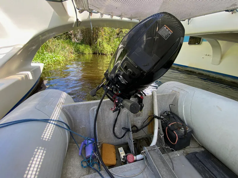 Slide: The Image of Inflatable boat with outboard motor, Custom 62 model, 1996, on a calm river. - 13