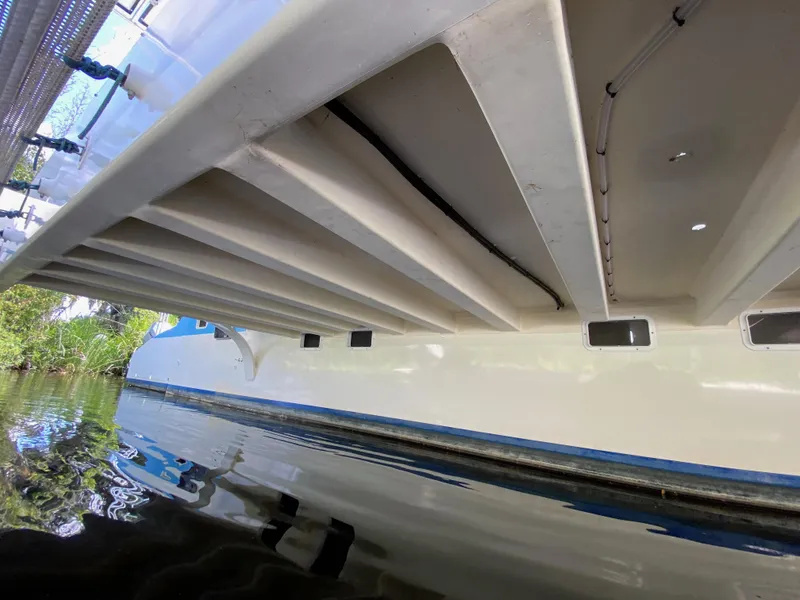 Slide: The Image of Underwater view of a 1996 Custom 62 boat hull with visible structural details. - 14