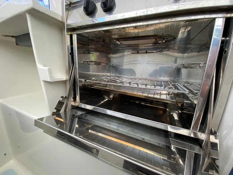 Slide: The Image of Stainless steel oven interior with open door, Custom model 62, 1996. - 30
