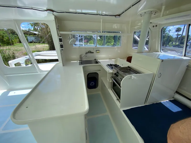 Slide: The Image of Interior of a 1996 Custom 62 boat with kitchen and appliances. - 31