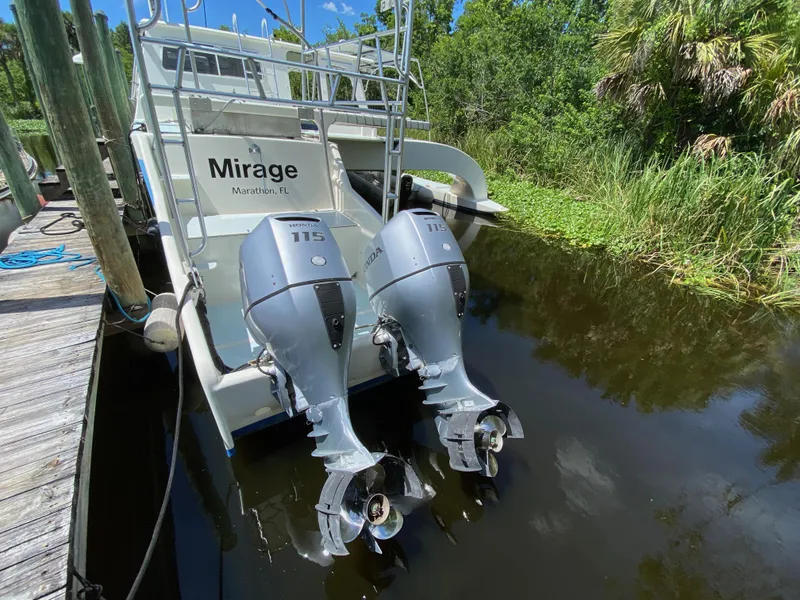 Slide: The Image of Boat deck with Quick Lift crane, solar panels, and lush greenery in the background. - 38