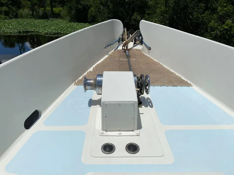 Slide: The Image of Open storage compartment on a 1996 Custom 62 boat, containing ropes and equipment. - 4