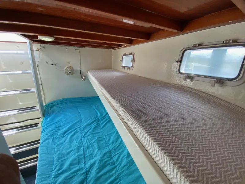 Slide: The Image of Compact boat cabin interior with bunk beds and small bathroom, Custom 62 model, 1996. - 46