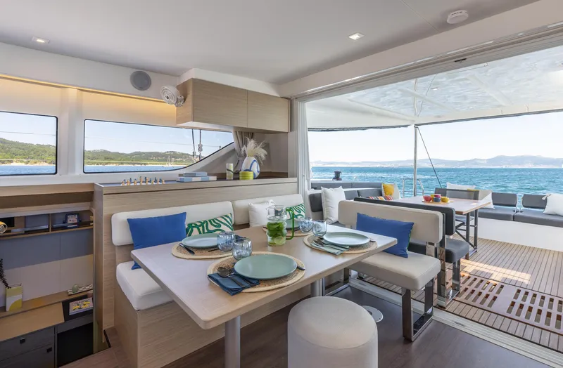 Slide: The Image of Luxurious interior of 2026 Lagoon 43 yacht with elegant dining area and ocean view. - 14