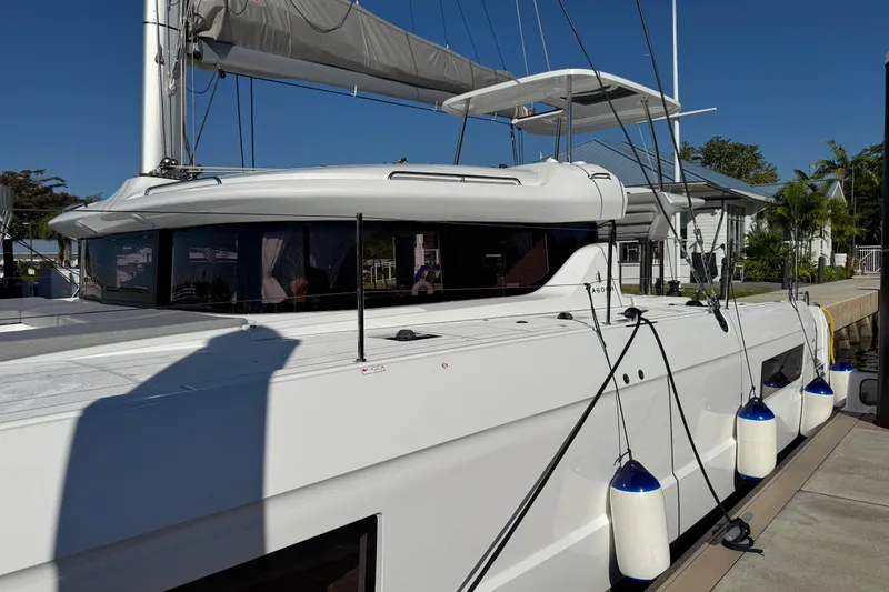 Slide: The Image of 2026 Lagoon 43 catamaran docked, featuring sleek design and modern amenities. - 21