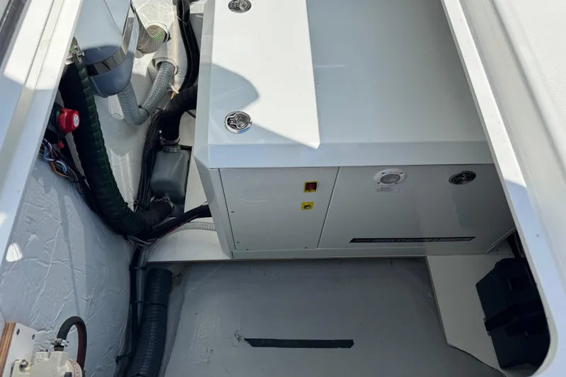Slide: The Image of Engine compartment of 2026 Lagoon 43 boat with visible wiring and components. - 25