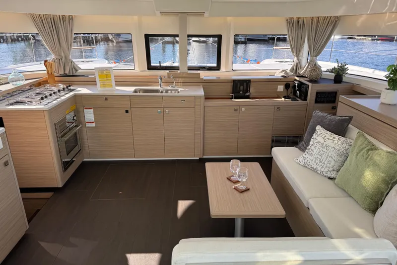 Slide: The Image of Modern interior of 2026 Lagoon 43 yacht with kitchen and seating area. - 28