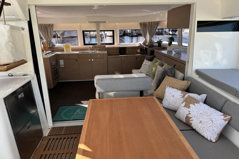 Slide: The Image of Luxurious interior of 2026 Lagoon 43 yacht with modern kitchen and cozy seating area. - 29