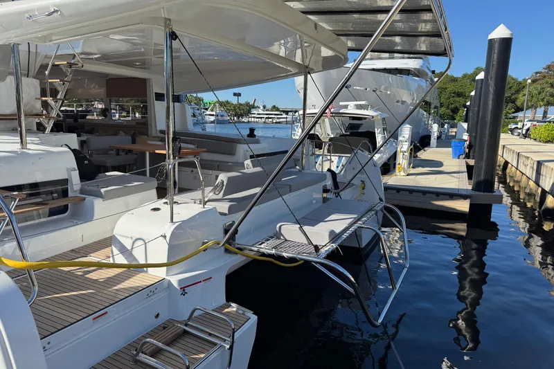 Slide: The Image of Luxury Lagoon 43 yacht docked at marina, showcasing sleek design, 2026 model. - 33