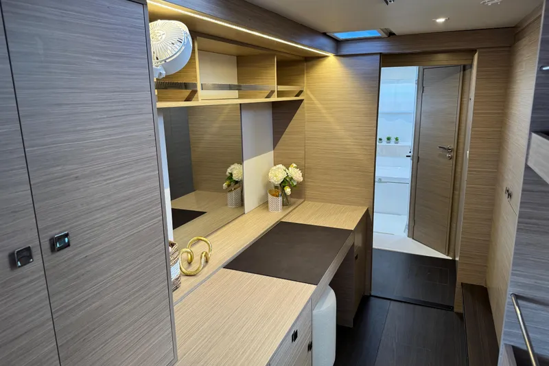 Slide: The Image of Luxurious interior of 2026 Lagoon 43 yacht with modern wood finish and elegant decor. - 38