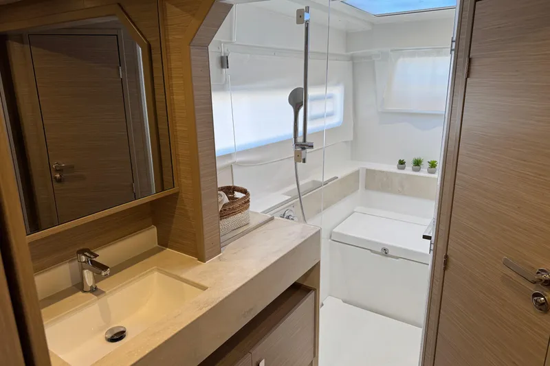 Slide: The Image of Modern bathroom in 2026 Lagoon 43 yacht with sleek design and natural wood accents. - 39